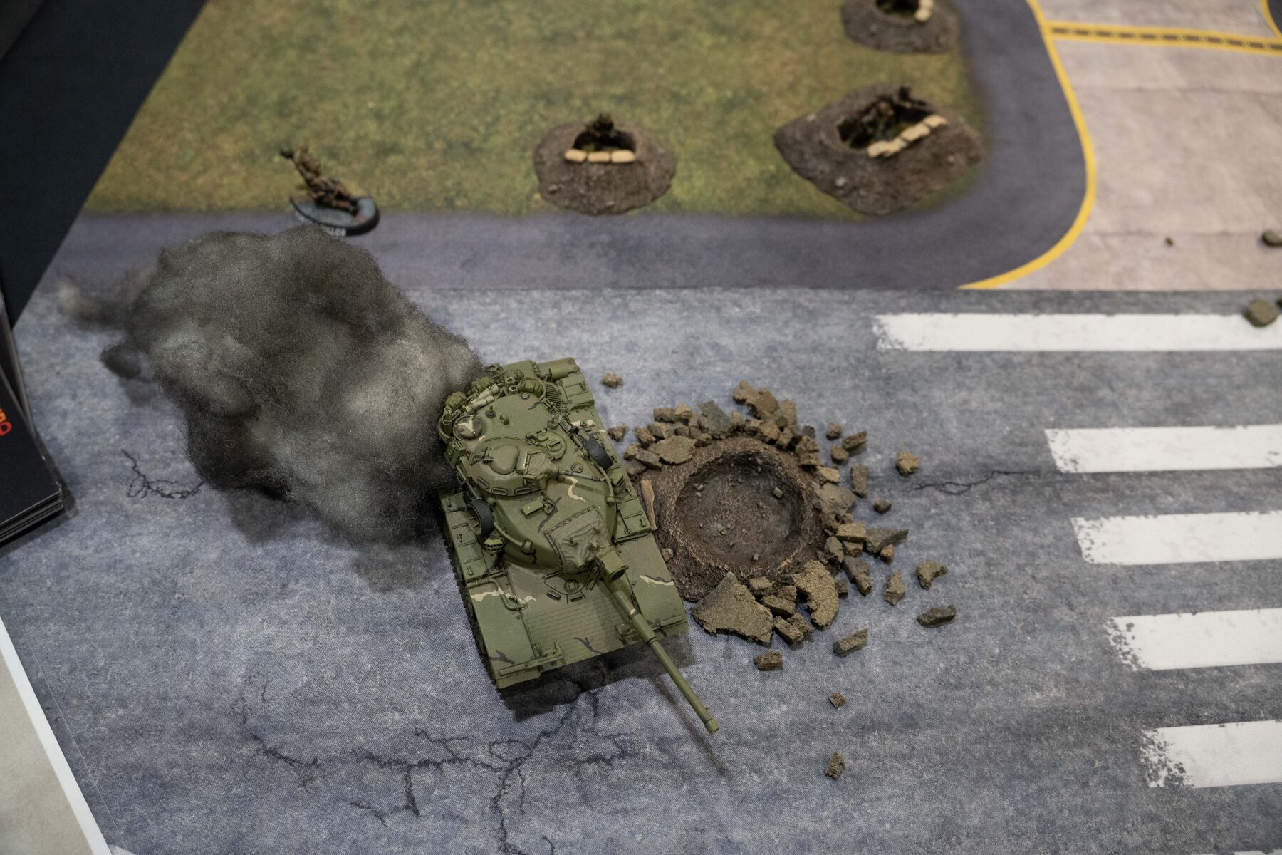 A tank model on the demo table taking fire